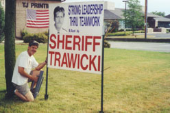 Trawicki poses by a campaign sign. He gained 70 percent of the votes in a September election to become Waukesha County sheriff. Photo courtesy of Dan Trawicki.