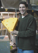 At the Foamation Inc.  factory, Ralph Bruno shows off a Cheesehead. Photo by Michelle Wexler
