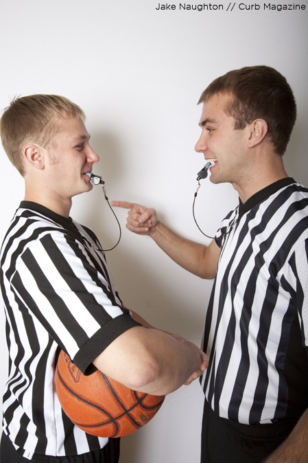 Travis Blomberg (right) plays around with his brother Jeremy (left) pretending to scold him for an improperly made call.
