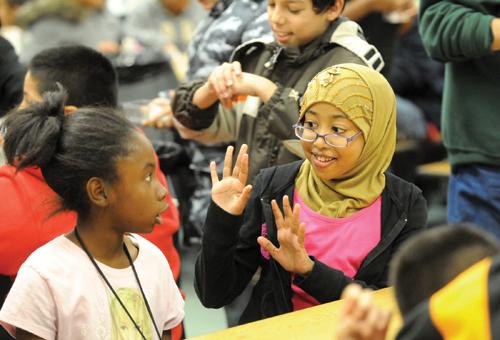 A Somali student talks with a classmate during lunch at Eisenhower Elementary School in Green Bay. Photo by H. Marc Larson/Green Bay Press-Gazette