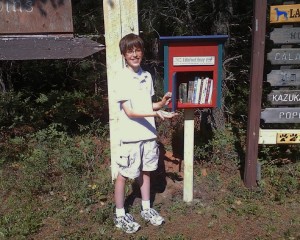 kid by little free library