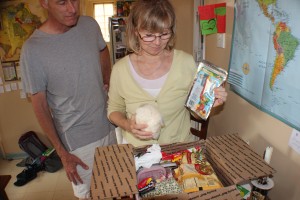 Jeff & Elsa Shaver opening a Christmas care package from home during their time in Botswana. Photo courtesy of Jeff and Elsa Shaver.