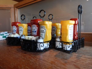 Condiment caddies are placed on tables each morning at the Great Dane at Hilldale in Madison, Wisconsin. Photo by Sophie Dubuisson.