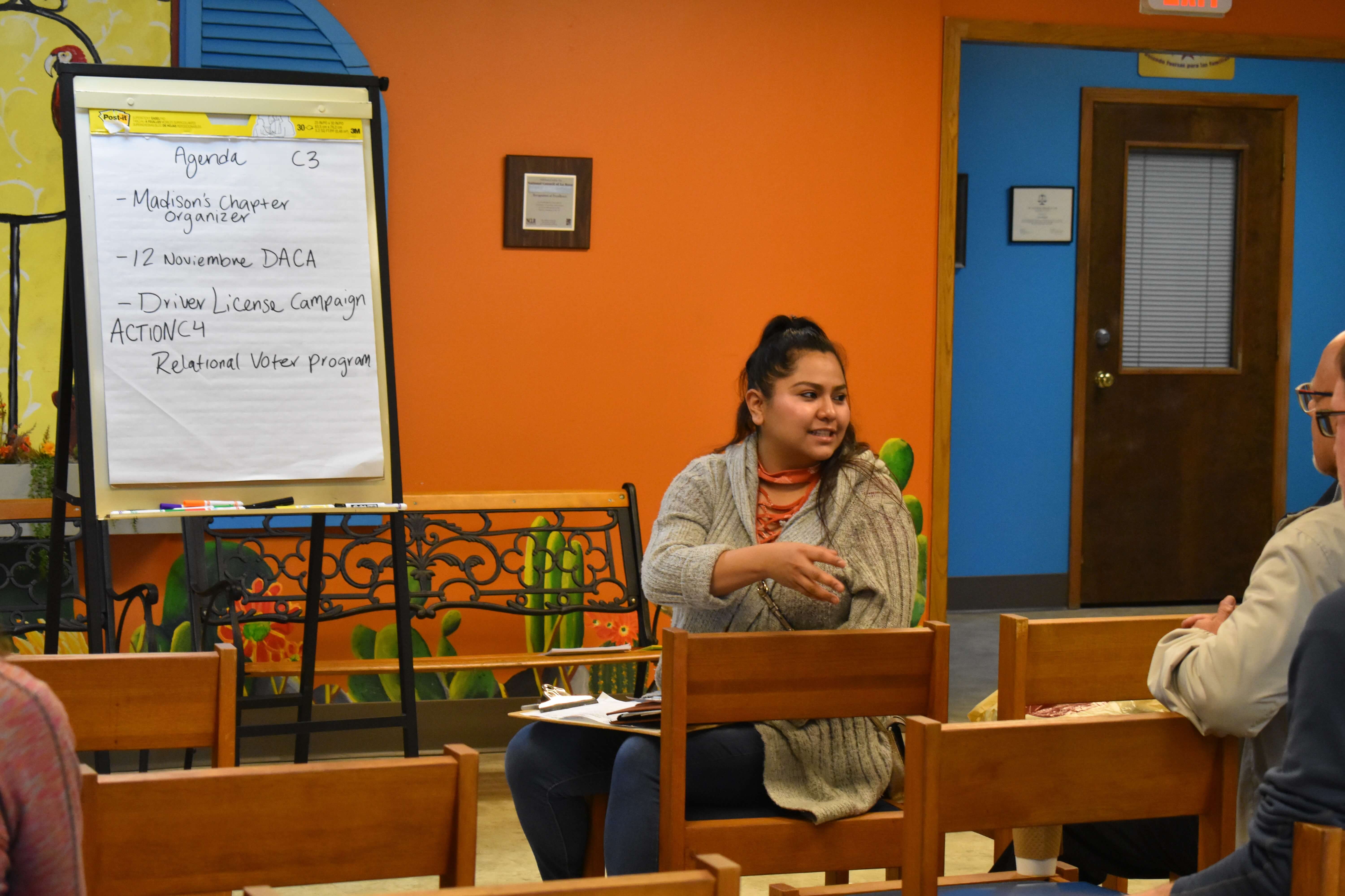 Larissa helping to lead a Voces de la Frontera meeting
