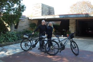 Joyce and Phil Wall standing with their e-bikes