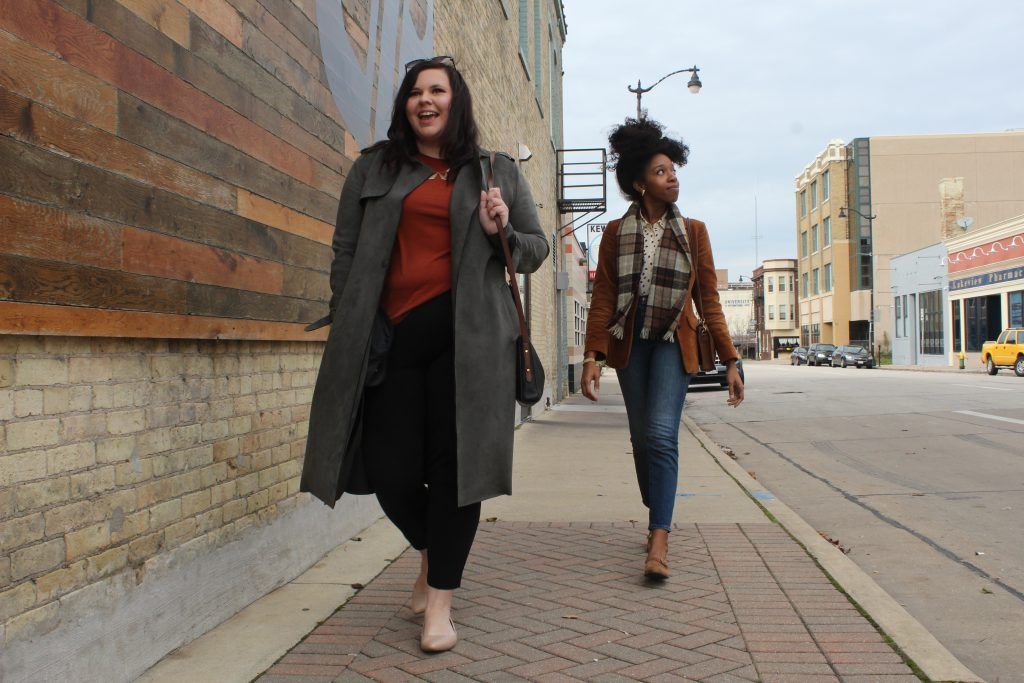 The co-founders of What's Up Racine walk down the street