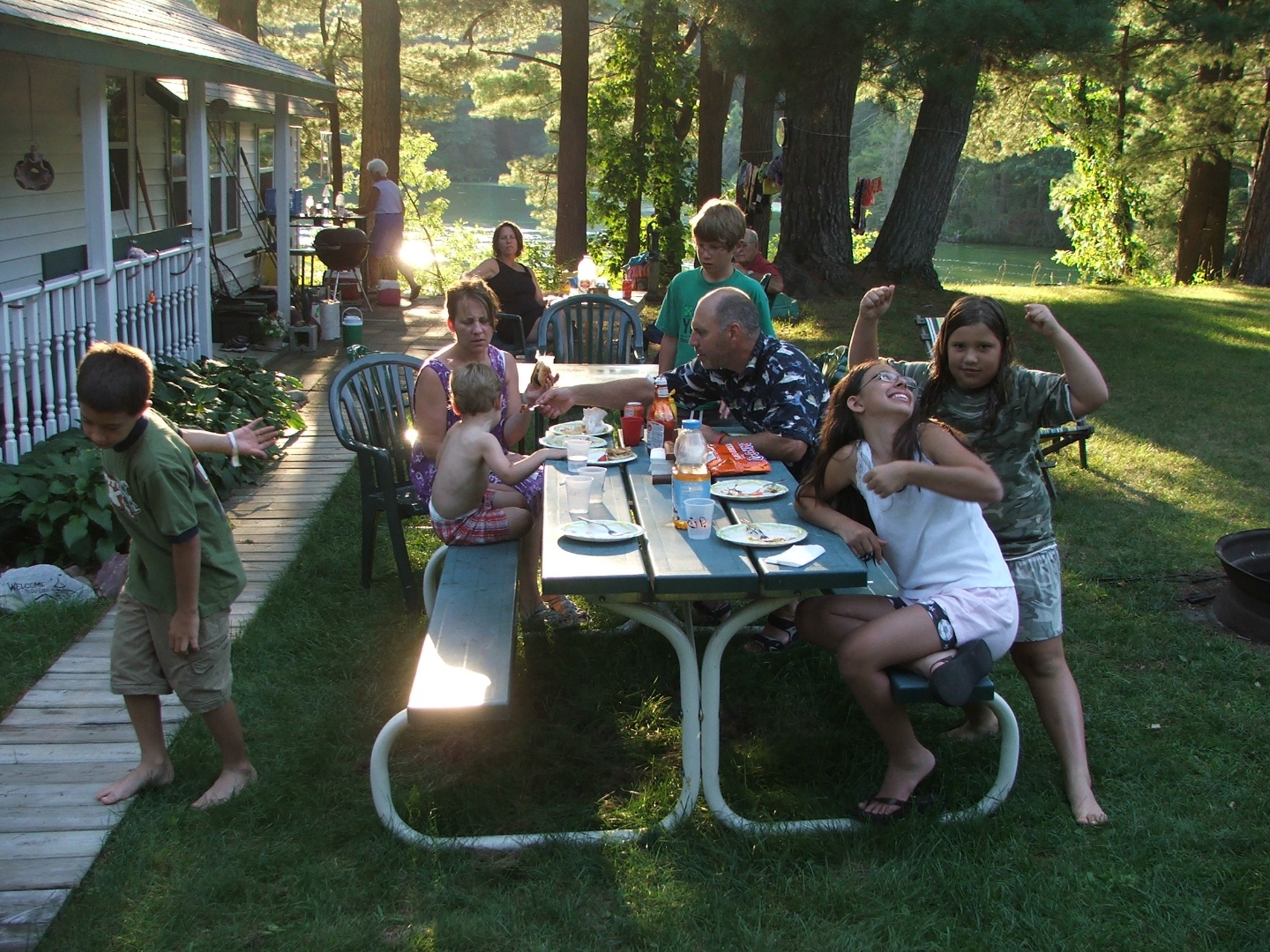 A family eats at a picnic table