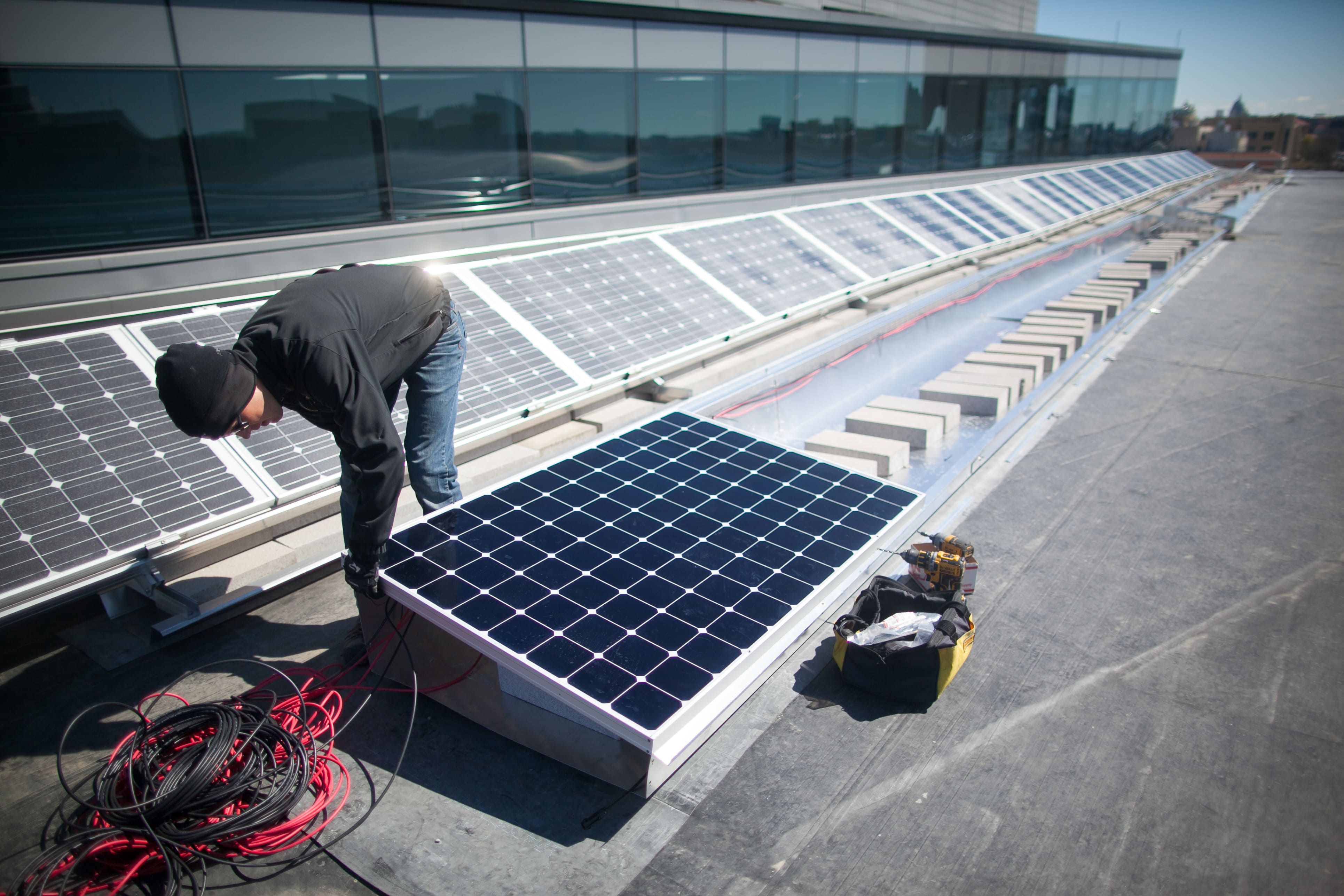 Man installing solar panel 