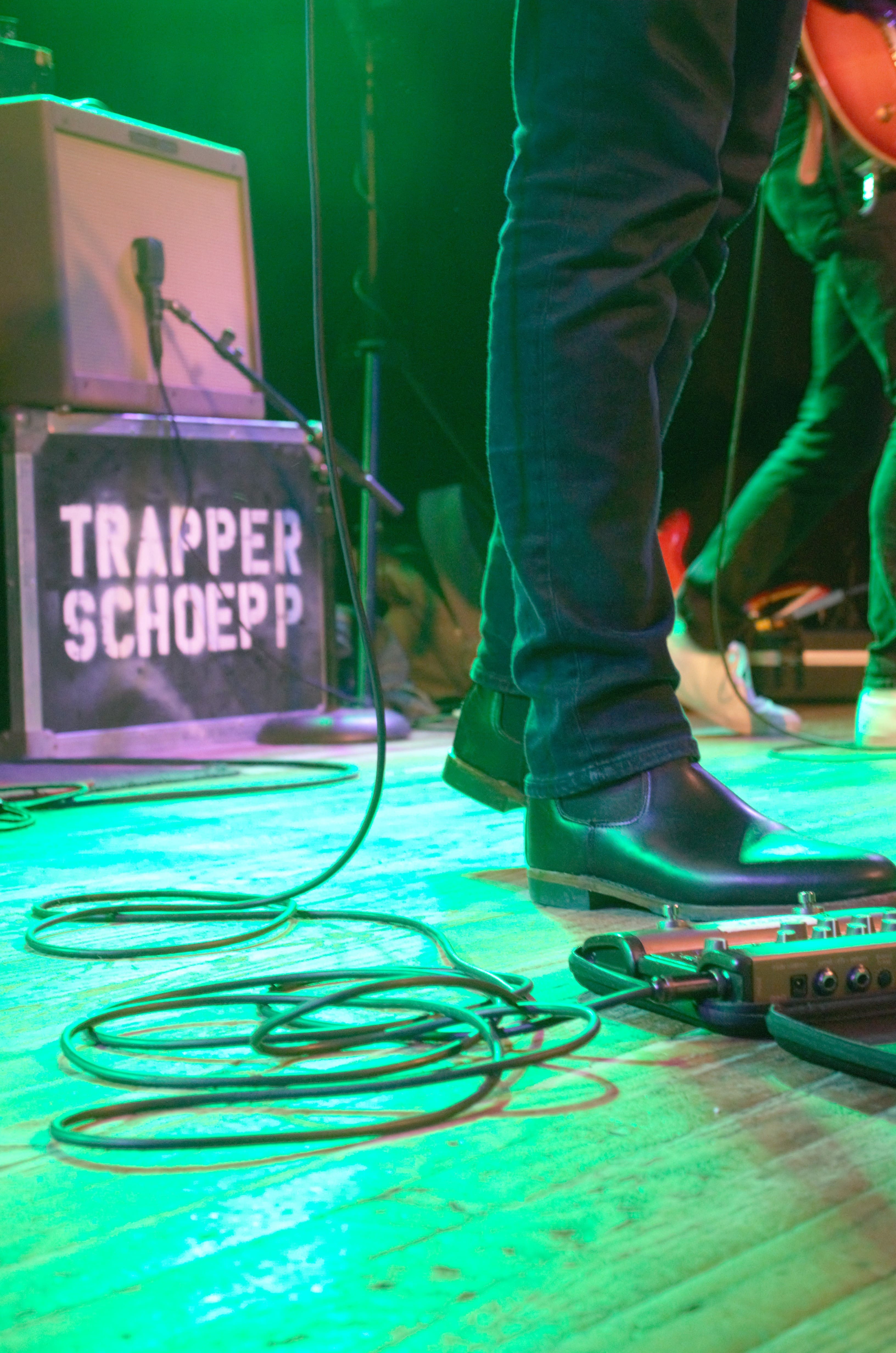 A pedal board and amp at Trapper Schoepp's show