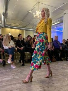A model walks down the runway at Milwaukee fashion week