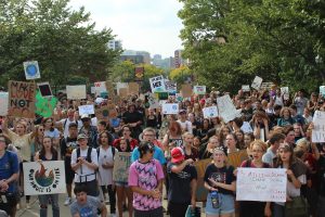 Thousands stand in front of the Capitol advocating for a more sustainable future