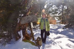Woman on snowy hiking trail