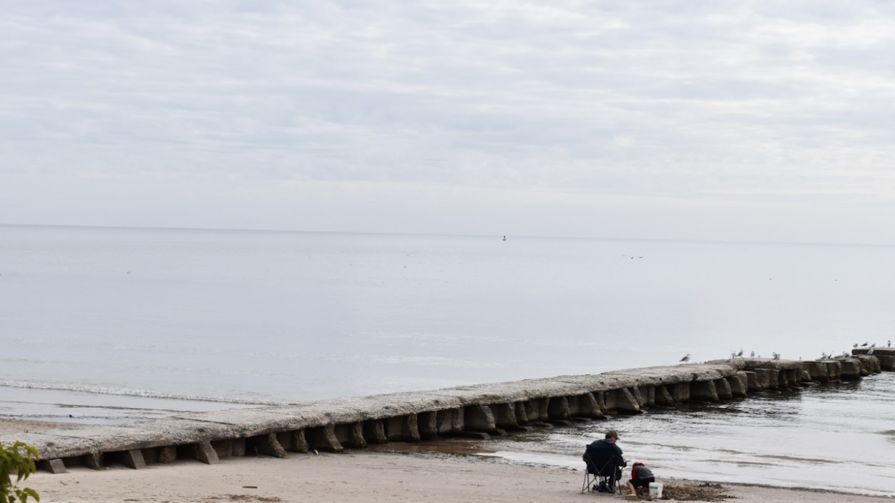 The water is quiet on this cold Sunday morning, but that doesn’t stop people from enjoying the lake’s beauty.