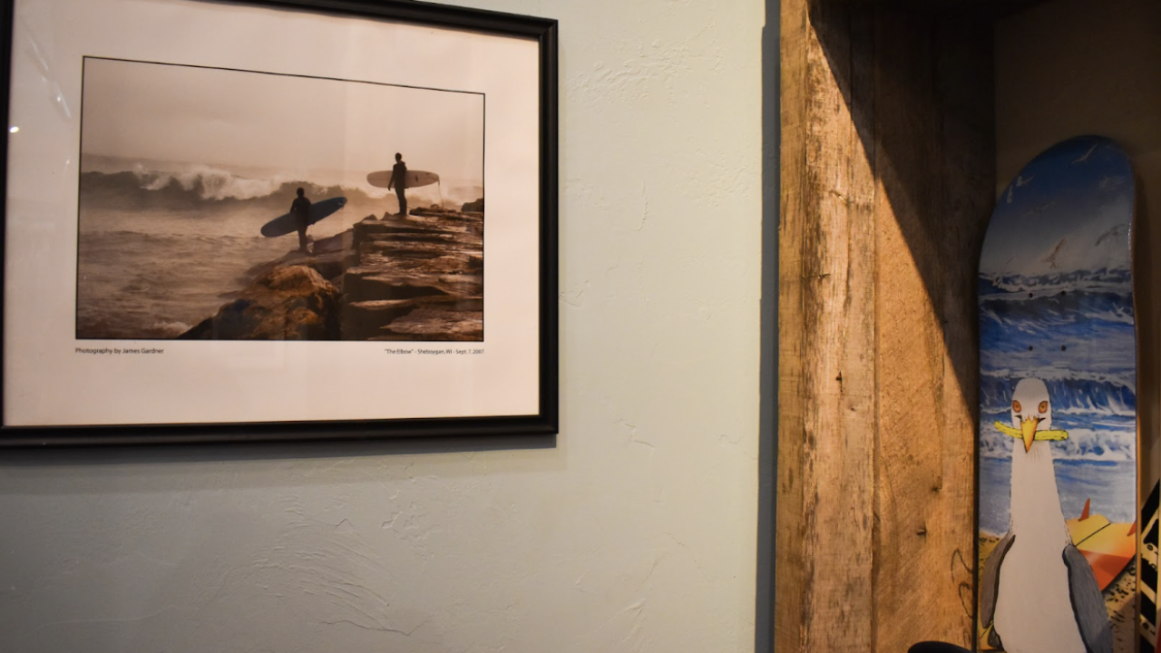 The shop is decorated with surfing images from the Great Lakes throughout the years.